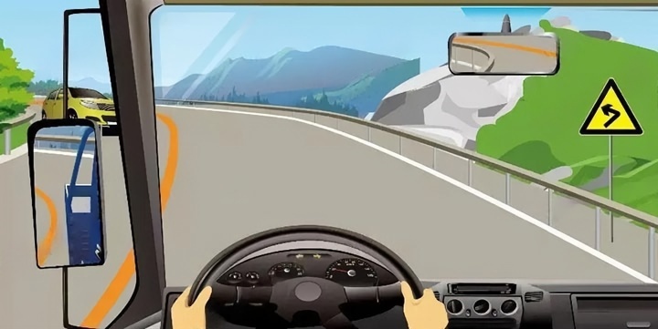 如图所示，驾驶机动车行经该弯道路段时，可以停车。配图